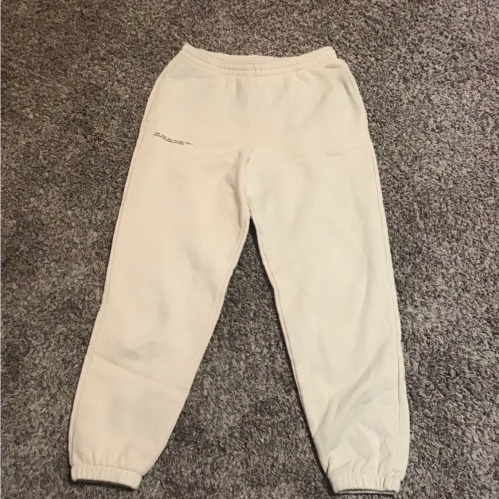 Brand is pangaia, color beige, size small/medium